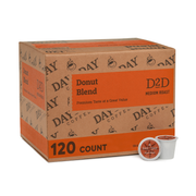 Box of Day Coffee Donut Blend K-Cups with two single pods on a white background