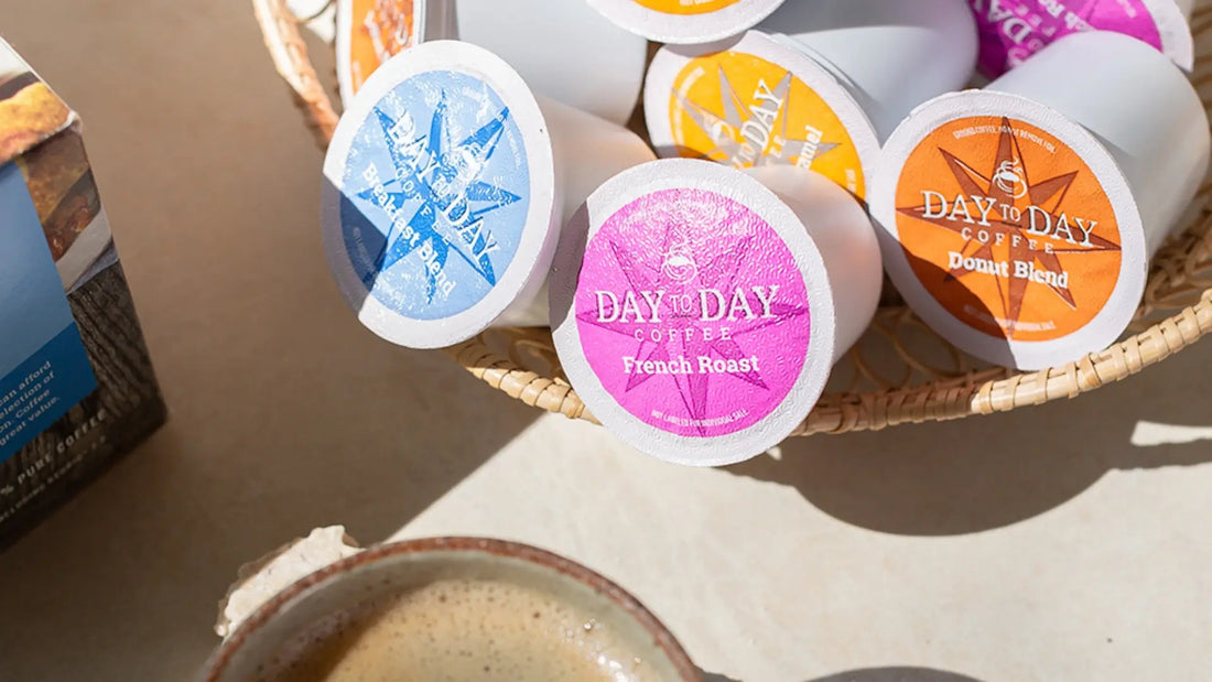 Day by Day Coffee K-cups in a basket with a bowl of coffee on a light surface